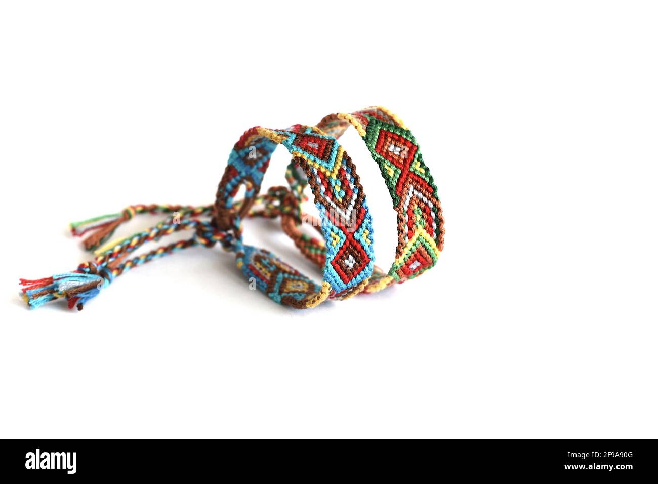 DIY friendship bracelets with Indian colorful pattern handmade of