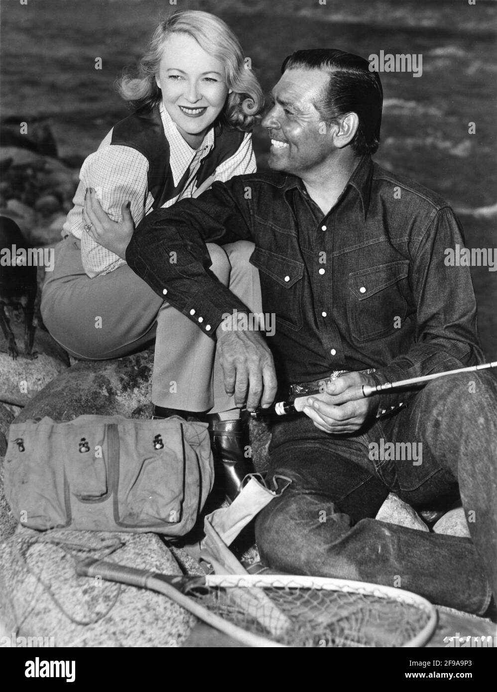CLARK GABLE and his 4th Wife SYLVIA ASHLEY on location candid in Colorado during filming of ACROSS THE WIDE MISSOURI 1951 director WILLIAM A. WELLMAN screenplay Talbot Jennings book Bernard DeVoto Metro Goldwyn Mayer Stock Photo
