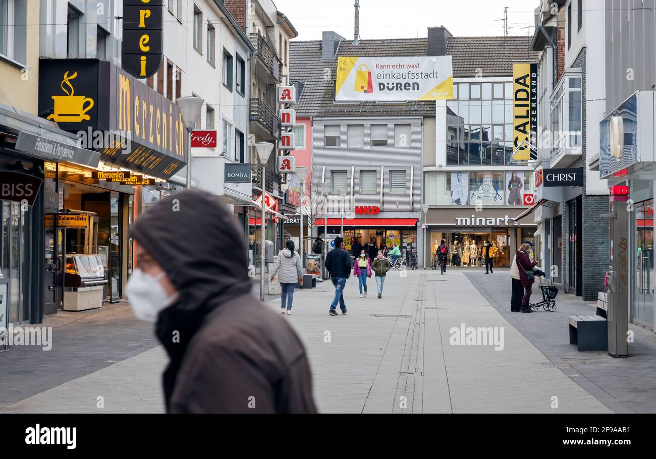 Düren, North Rhine-Westphalia, Germany - Düren city center in times of the  corona crisis during the second lockdown, most shops are closed, only a few  passers-by are walking on Wirtelstrasse, the main