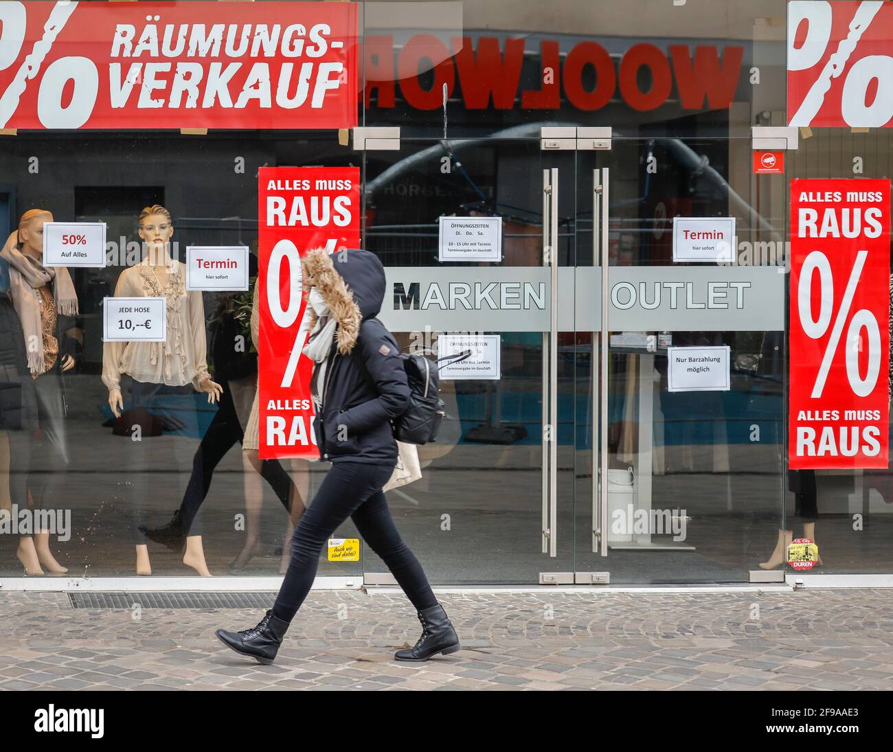 Düren, North Rhine-Westphalia, Germany - Düren city center in times of the corona crisis during the second lockdown, most shops are closed, few passers-by in the pedestrian zone, a fashion store offers Sofort Click & Meet, register immediately and shop immediately. Stock Photo