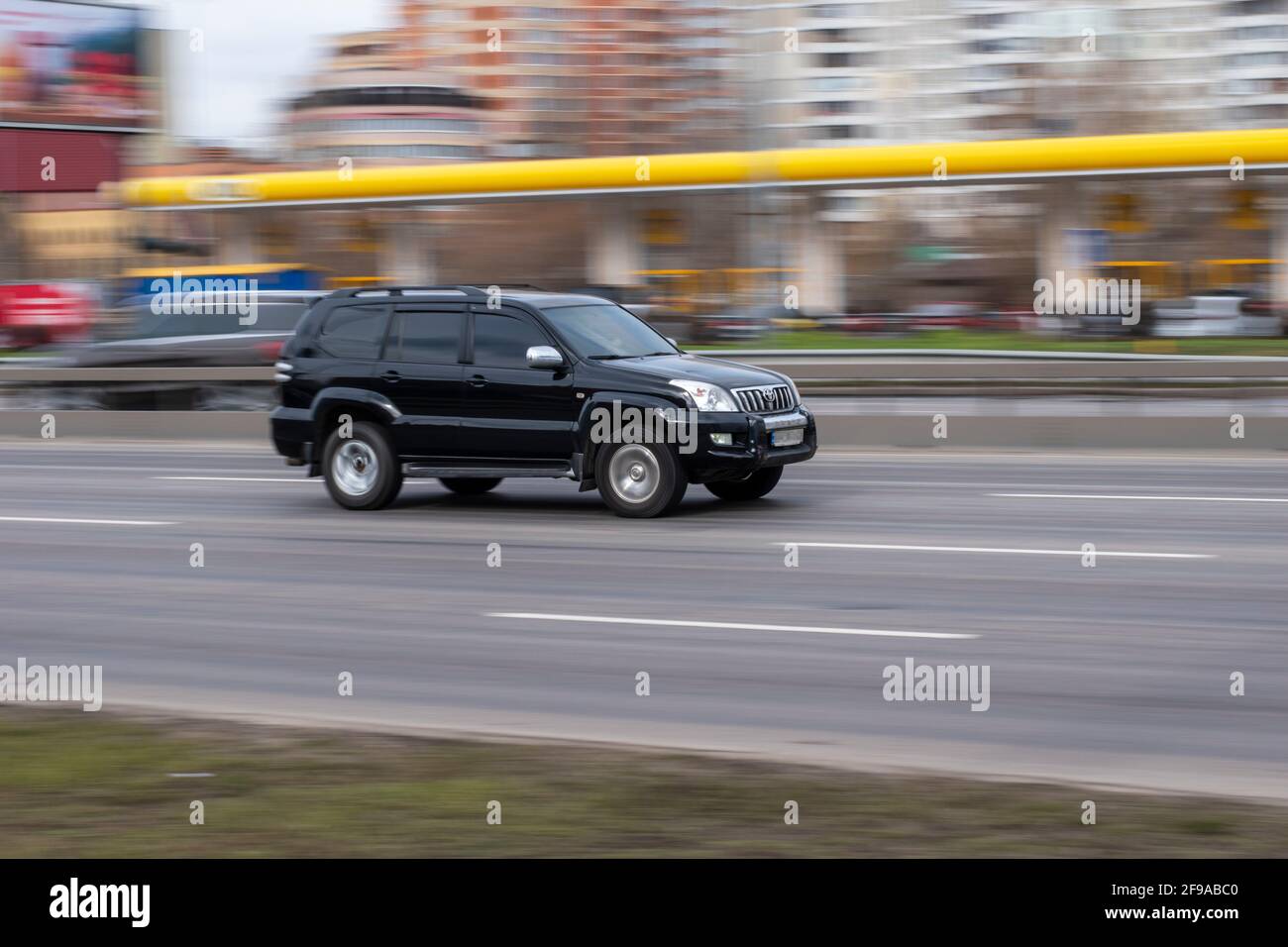 Ukraine, Kyiv - 18 March 2021: Black Toyota Land Cruiser Prado car moving on the street. Editorial Stock Photo