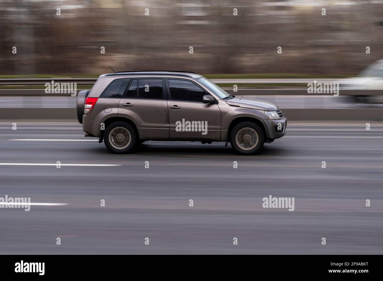 Ukraine, Kyiv - 18 March 2021: Silver Suzuki Grand Vitara car moving on the street. Editorial Stock Photo