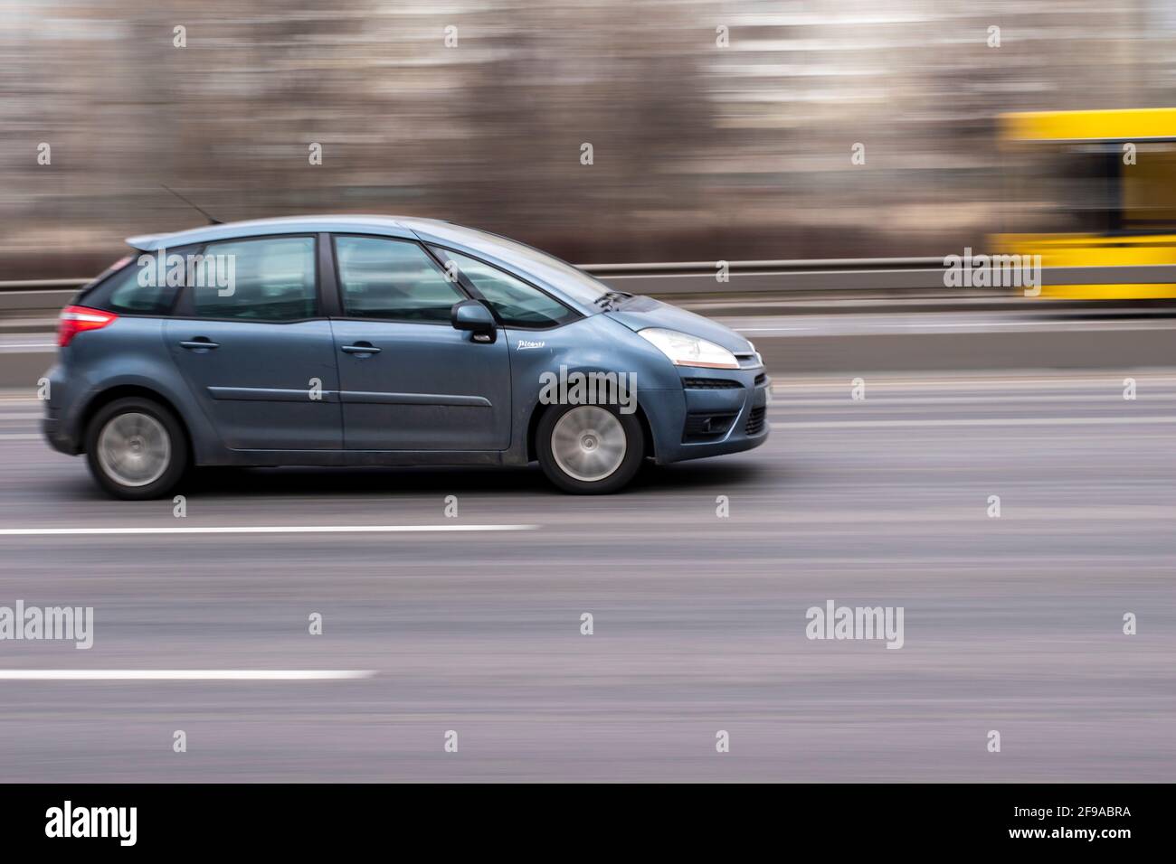 Ukraine, Kyiv - 18 March 2021: Blue Citroen C4 Picasso car moving on the street. Editorial Stock Photo
