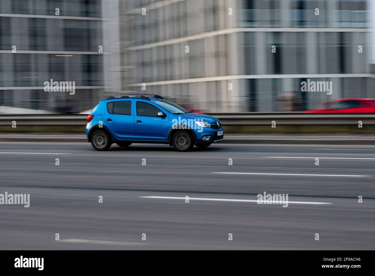 Ukraine, Kyiv - 11 March 2021: Light Blue Dacia Sandero car moving on the street. Editorial Stock Photo