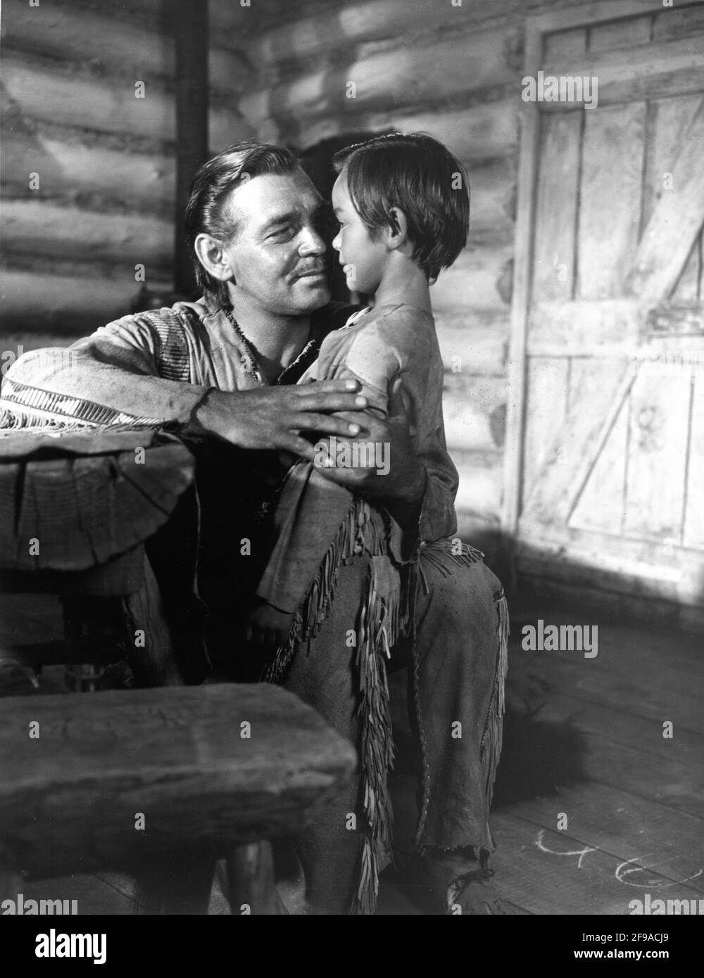 CLARK GABLE and Young Child in ACROSS THE WIDE MISSOURI 1951 director WILLIAM A. WELLMAN screenplay Talbot Jennings book Bernard DeVoto Metro Goldwyn Mayer Stock Photo