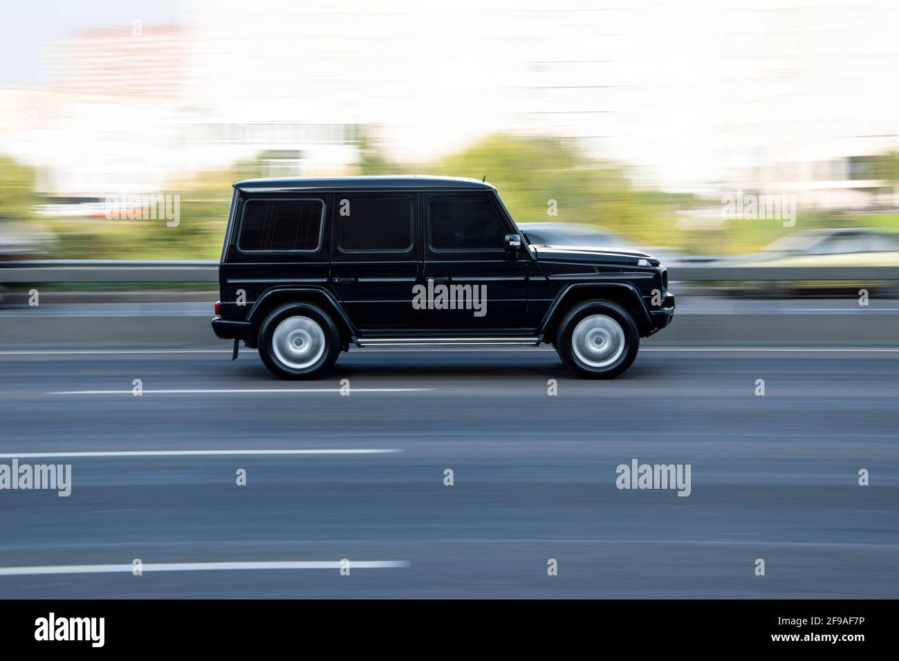 Ukraine, Kyiv - 10 December 2020: Black Mercedes-Benz G-Class  moving on the street Stock Photo