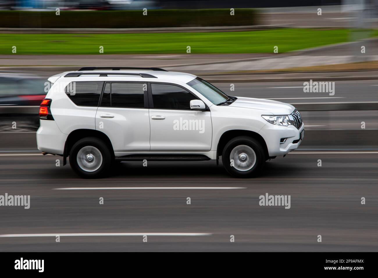 Ukraine, Kyiv - 29 September 2020: White Toyota Land Cruiser Prado car moving on the street Stock Photo