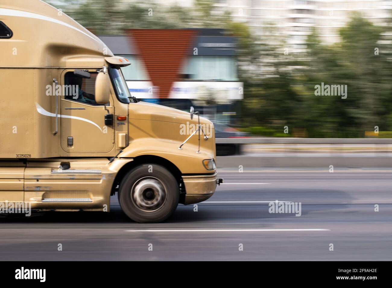 Ukraine, Kyiv - 24 September 2020: Yellow Truck moving on the street Stock Photo