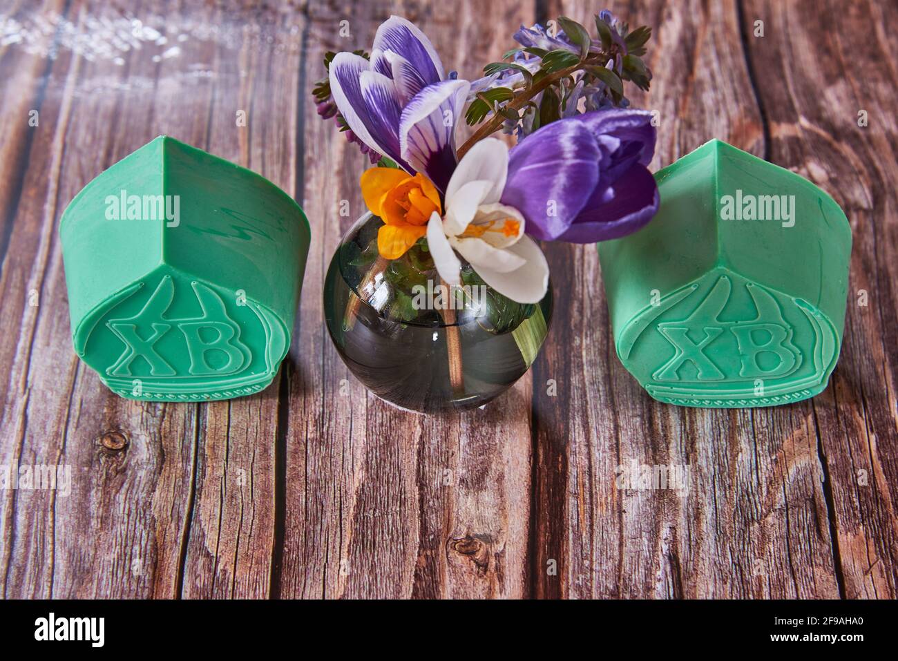 Bright handmade Easter soap and Easter holiday decor on wooden