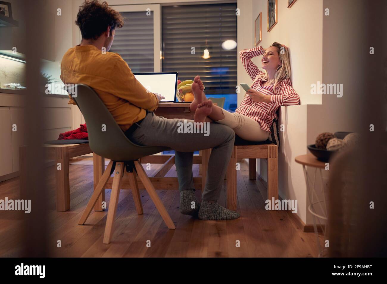 young couple enjoying together, working from home, spending valentine in isolation. Valentine during covid lockdown concept Stock Photo