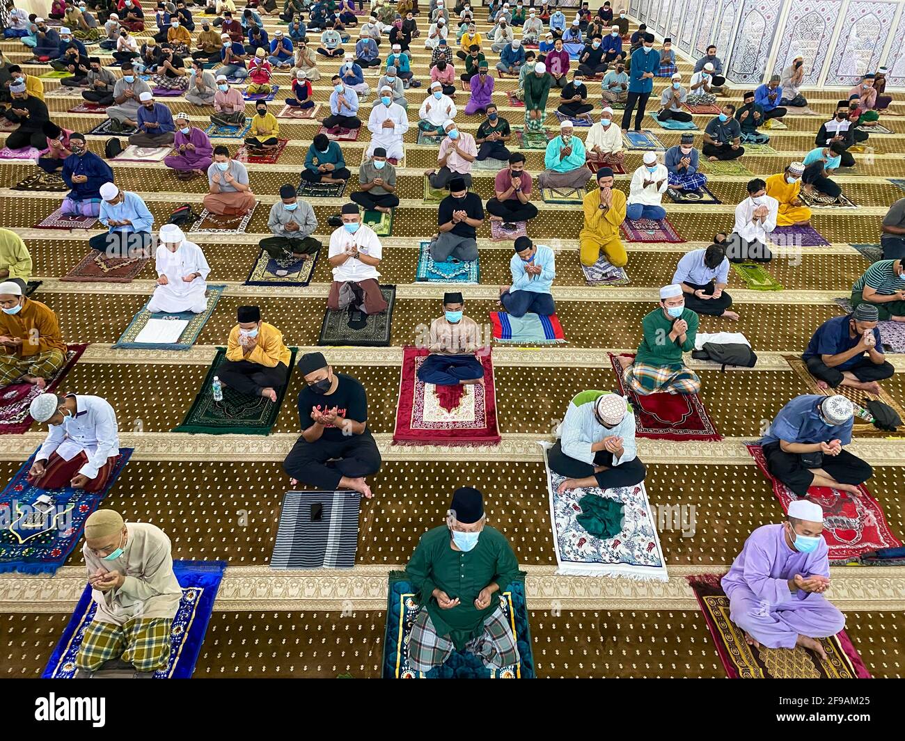 Muslim people perform Tarawih prayer, prayers performed by Muslims at night after the Isha prayer during the holy month of Ramadan with social distanc Stock Photo