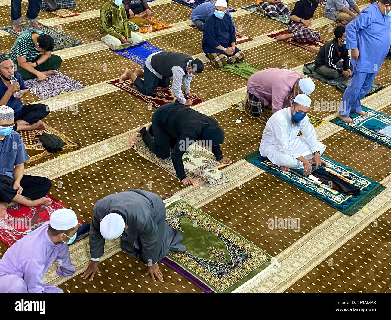 Muslim people perform Tarawih prayer, prayers performed by Muslims at night after the Isha prayer during the holy month of Ramadan with social distanc Stock Photo