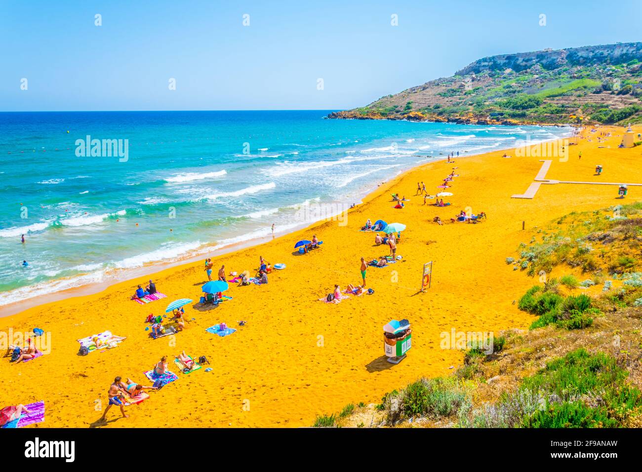 RAMLA BAY MALTA JUNE 7 2017 Ir Ramla Bay At Gozo Malta Stock Photo ramla-bay-malta-june-7-2017-ir-ramla-bay-at-gozo-malta-stock-photo