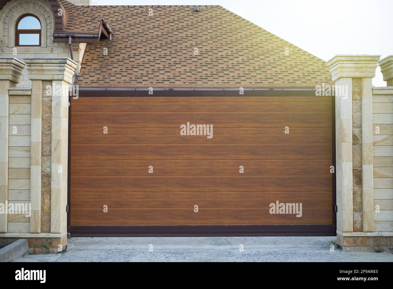 Modern sliding plastic gates for a private house Stock Photo