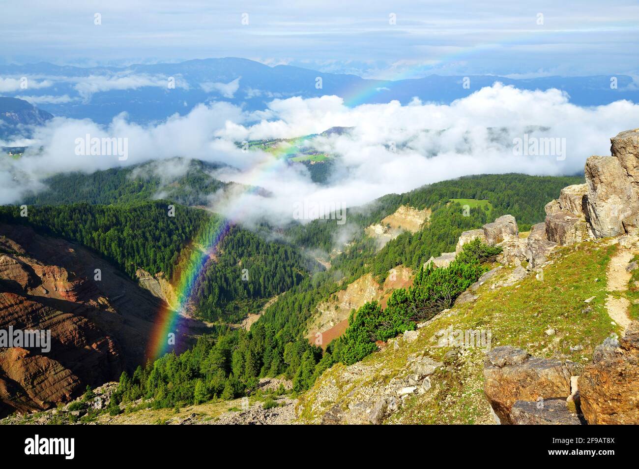Rainbow above the Bletterbach canyon in Dolomites. South Tyrol, Italy. Stock Photo