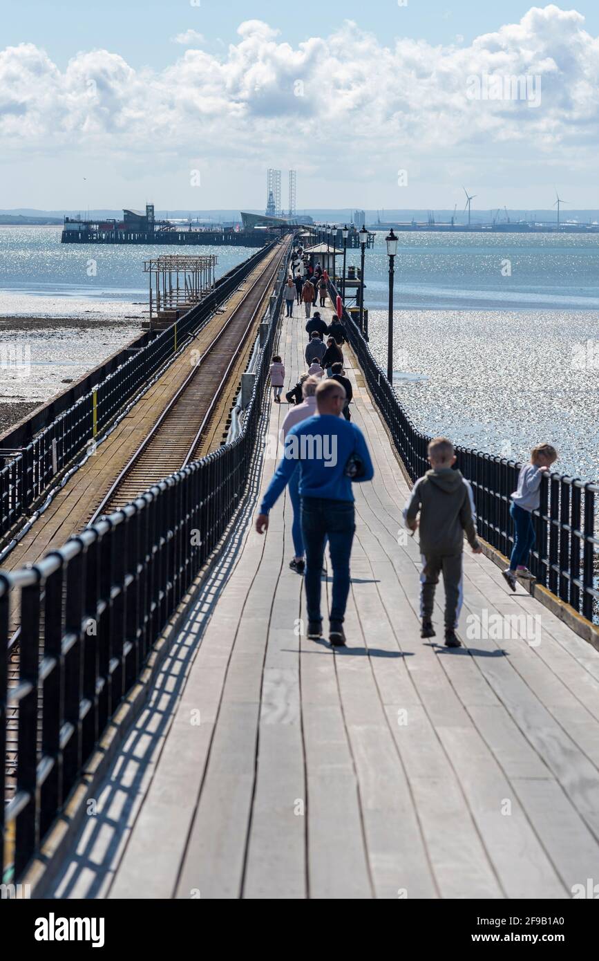 Southend on Sea, Essex, UK. 17th Apr, 2021. The seaside town of Southend on Sea is expecting a busy day as the UK continues step 2 of the roadmap out of lockdown. The pier is also open. Young family heading out Stock Photo