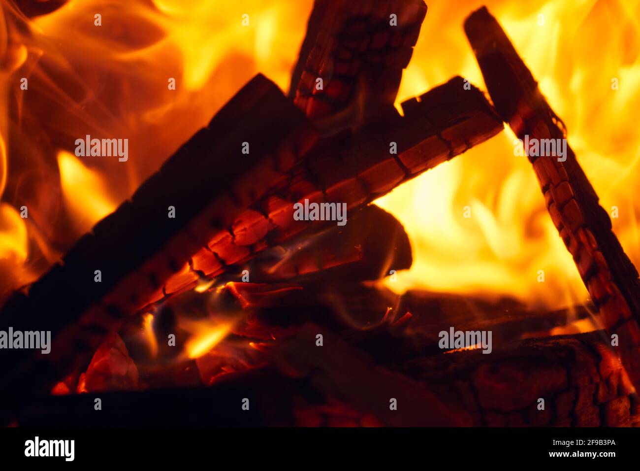 A fire burns in a fireplace, Fire to keep warm. Logs burning in a