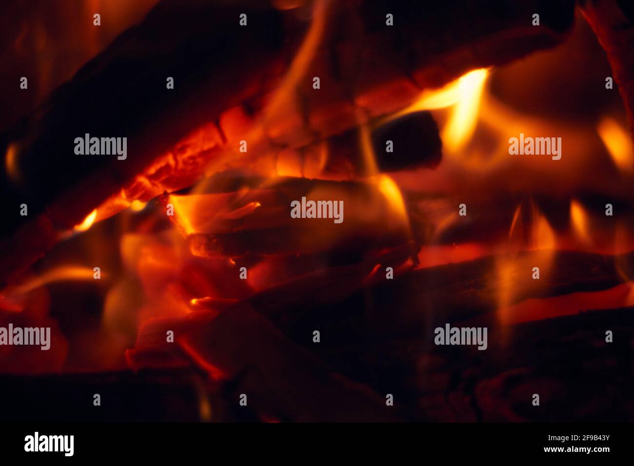 A fire burns in a fireplace, Fire to keep warm. Logs burning in a