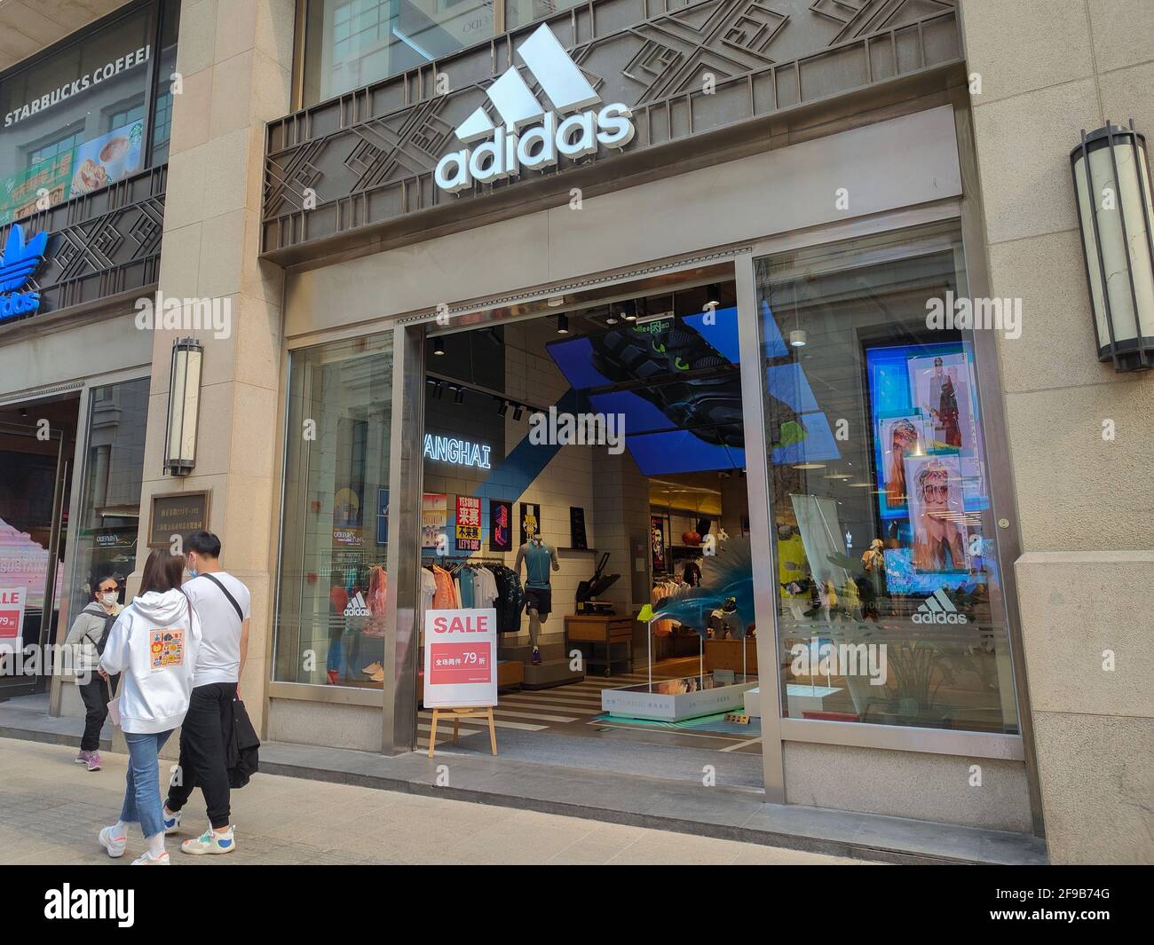 SHANGHAI, CHINA - APRIL 16, 2021 - Ads for discount promotion at the door  of Adidas stores, April 16, 2021, Shanghai, China. (Photo by Wang Gang /  Costfoto/Sipa USA Stock Photo - Alamy