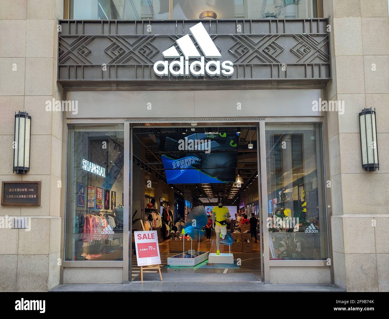 SHANGHAI, CHINA - APRIL 16, 2021 - Ads for discount promotion at the door  of Adidas stores, April 16, 2021, Shanghai, China. (Photo by Wang Gang /  Costfoto/Sipa USA Stock Photo - Alamy