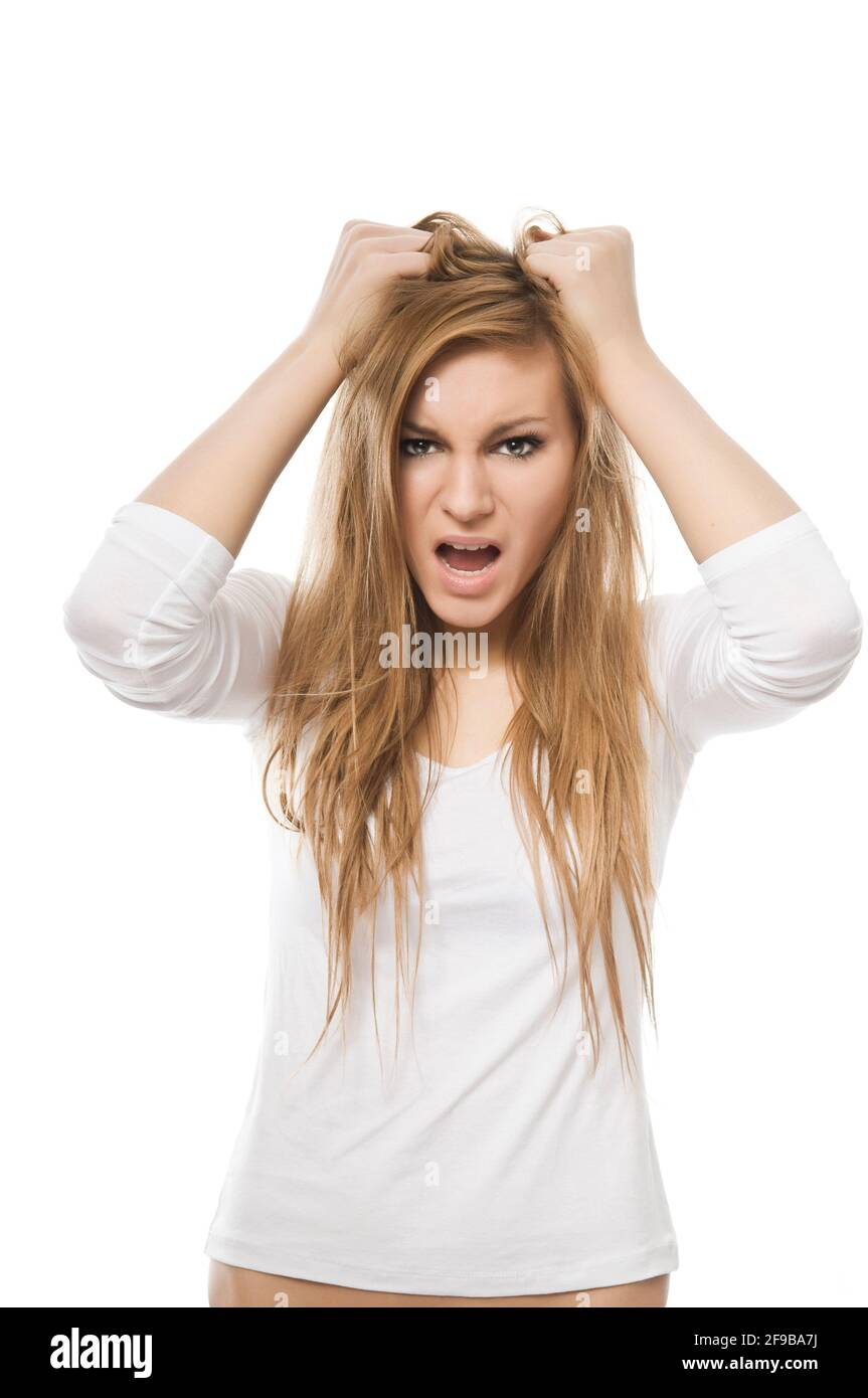 Bad Hair Day Woman under stress. Young woman pulls her hair with a
