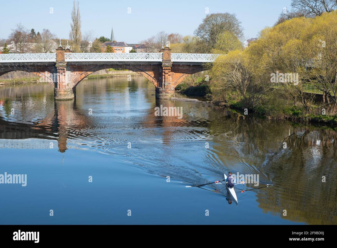 17th April in Dumfries, Scotland, members of the local rowing club take to the water as lockdown restrictions begin to ease. Stock Photo