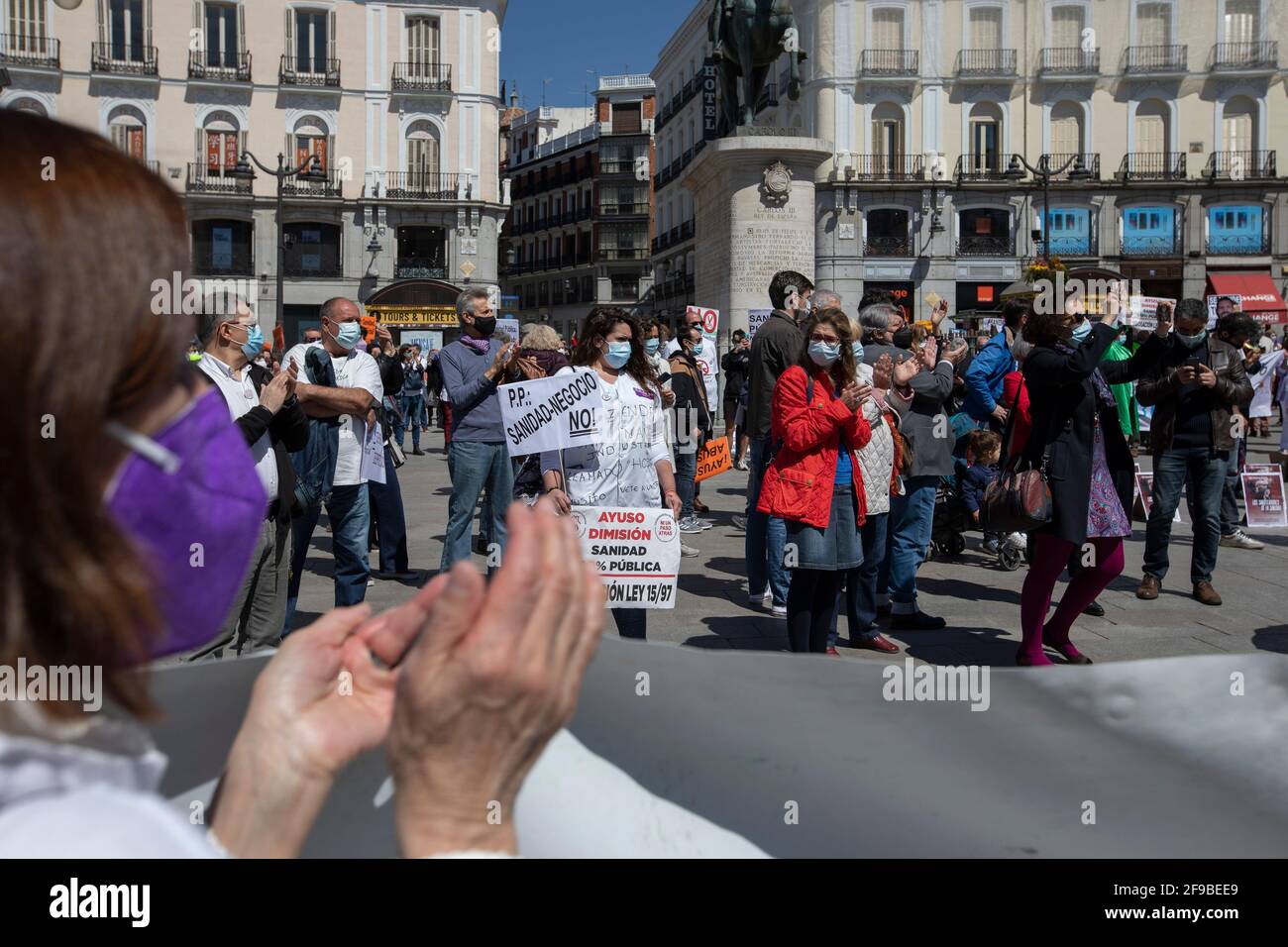Protesters hold placards during the demonstration.Under the slogan 'Choose Public Health', various organizations and collectives, workers and users of public health demonstrate in Madrid city center (Puerta del Sol) demanding a coherent health policy due to the crisis of the Coronavirus pandemic. Stock Photo