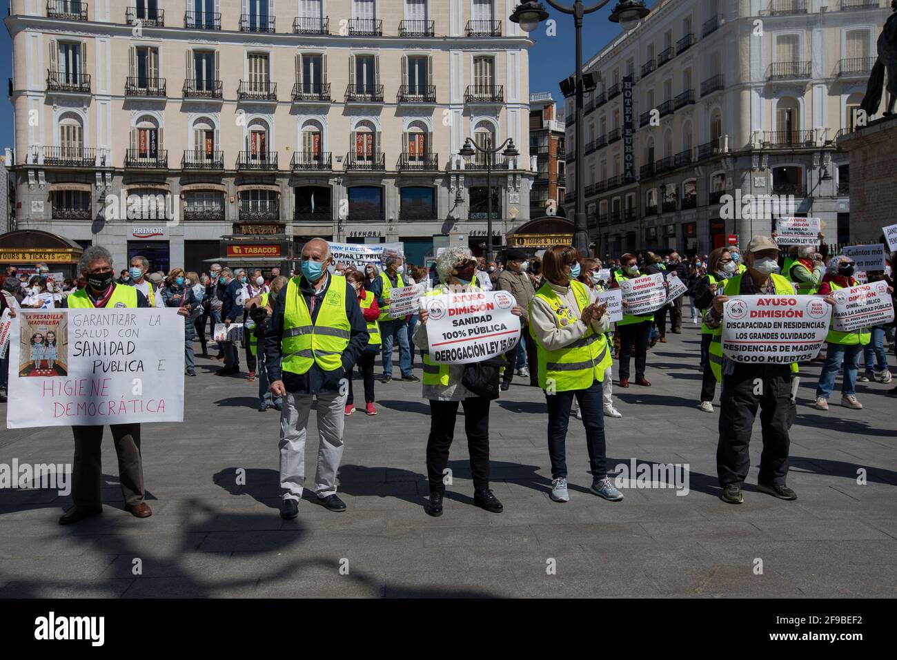 Protesters hold placards during the demonstration.Under the slogan 'Choose Public Health', various organizations and collectives, workers and users of public health demonstrate in Madrid city center (Puerta del Sol) demanding a coherent health policy due to the crisis of the Coronavirus pandemic. Stock Photo