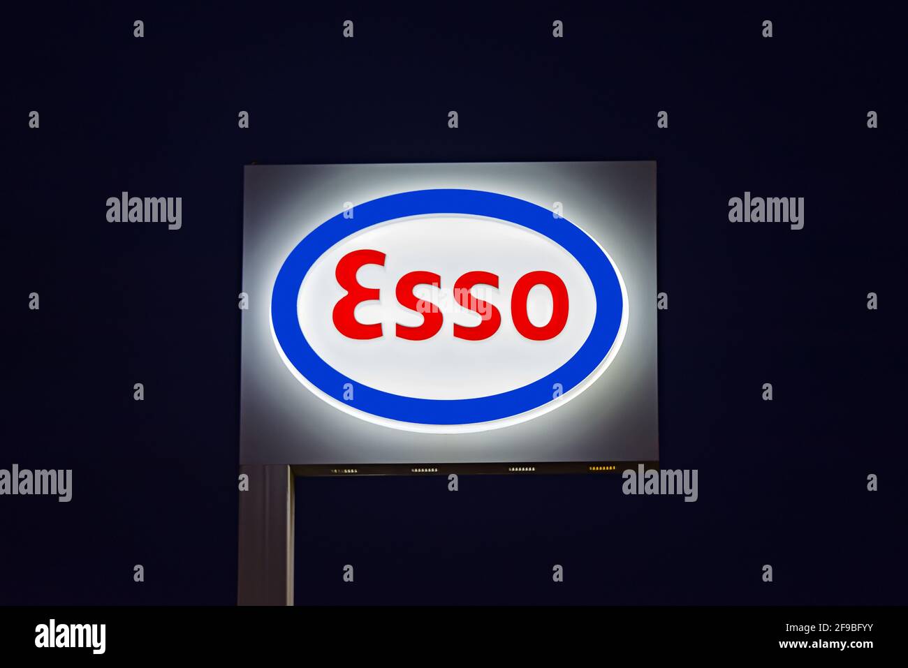 Esso Standard Oil logo is illuminated on the company's service station in Imperia, Italy Stock Photo