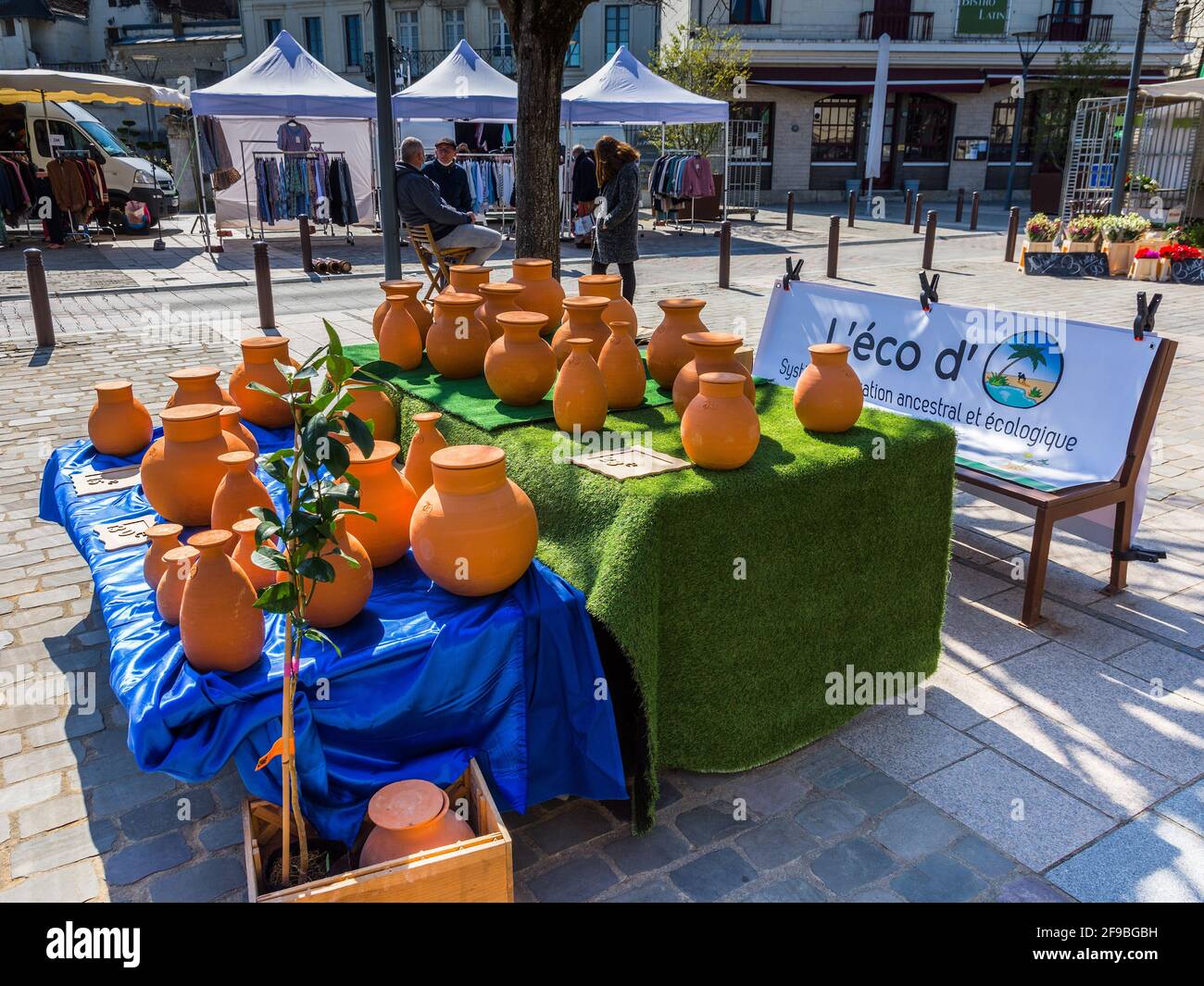 Market display table with terracotta "Eco" water pots - Loches, Indre-et-Loire, France. Stock Photo
