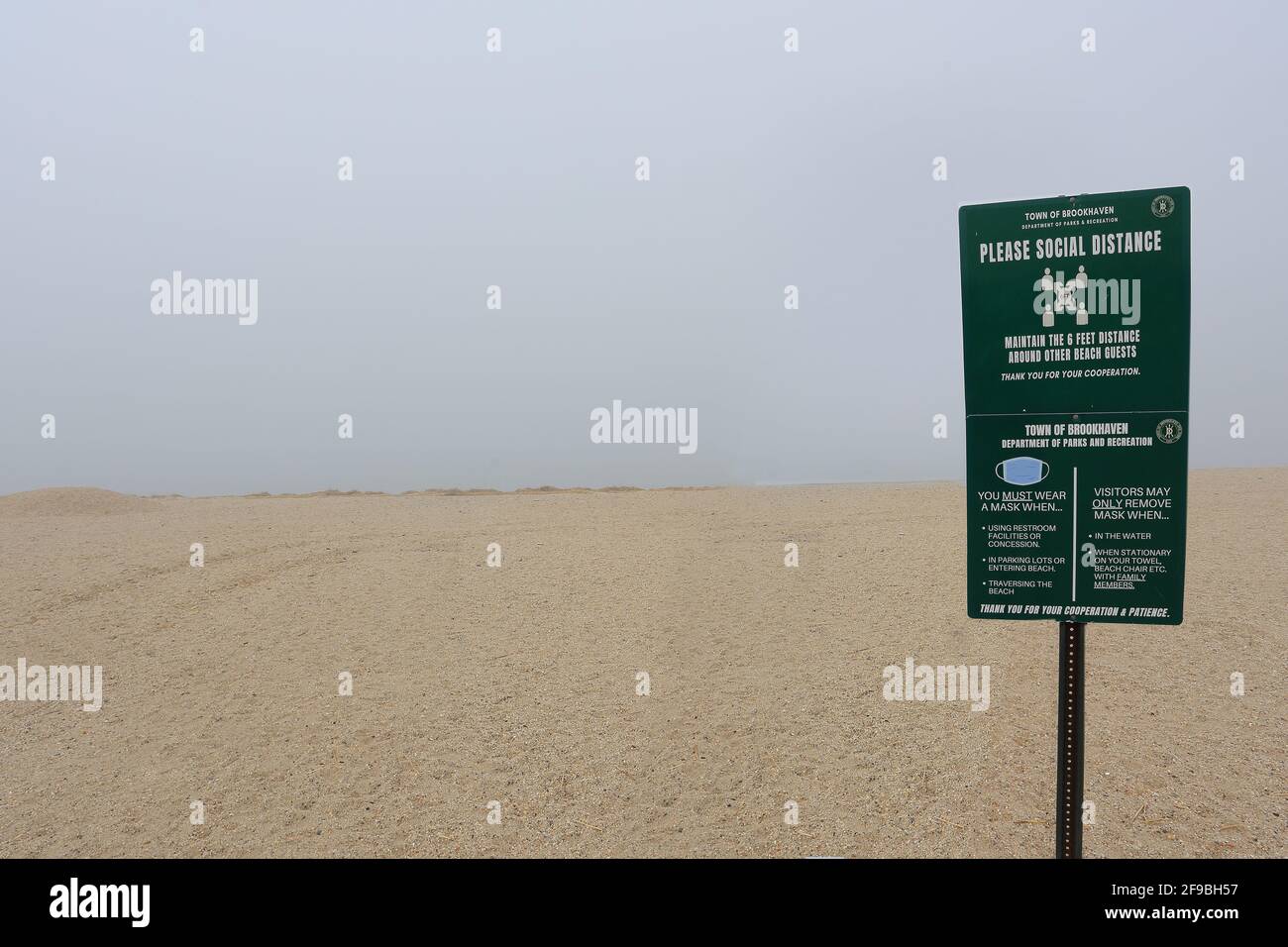 COVID social distancing sign West Meadow Beach Stony Brook Long Island New York Stock Photo