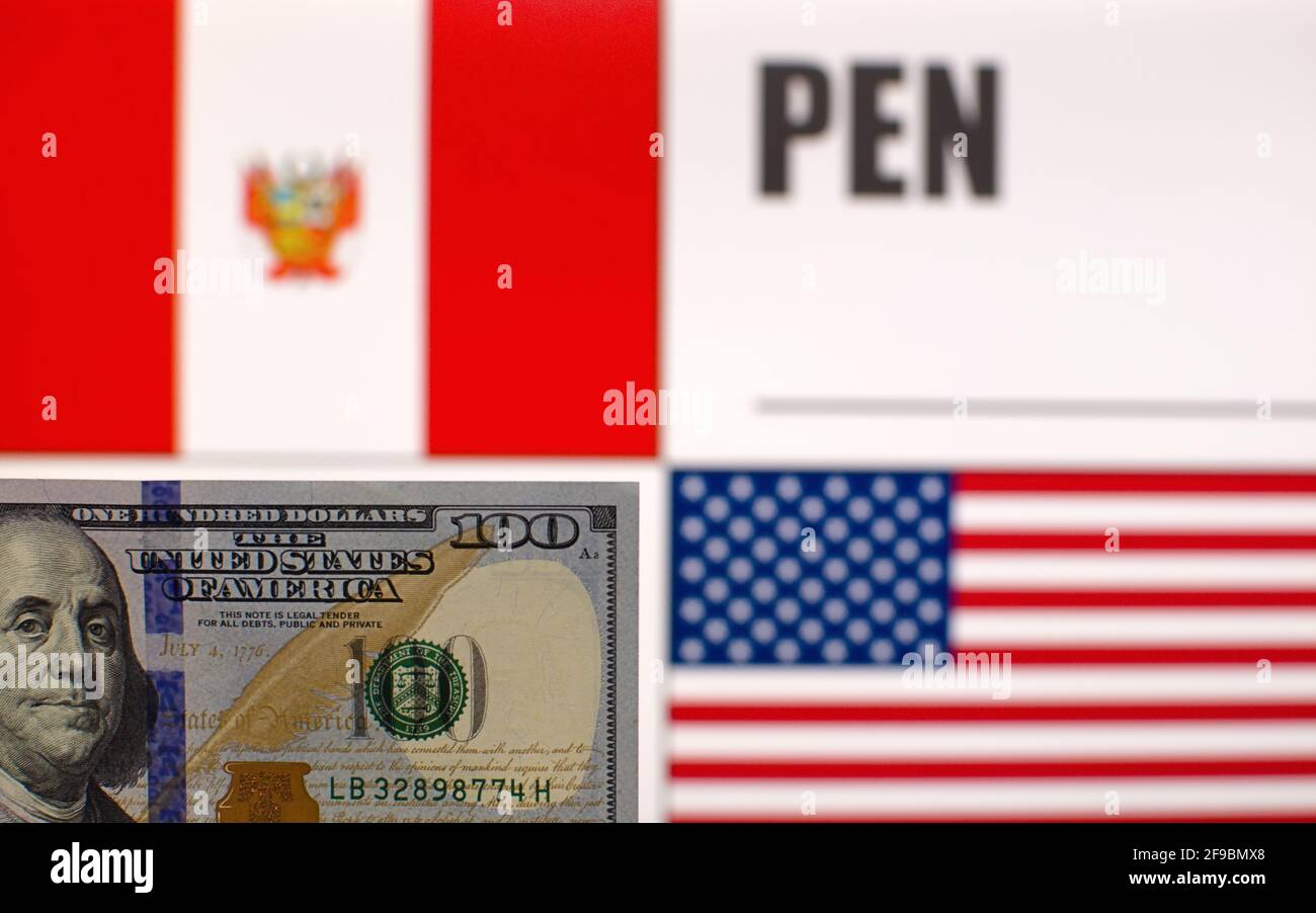 100 US dollars banknote on blurred background of Peru and USA flags and currency code of Peru. Exchange rate template Stock Photo