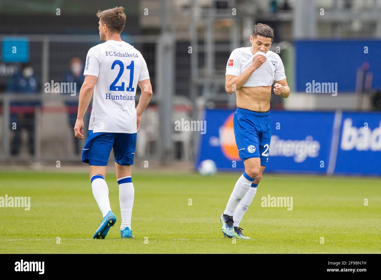Freiburg Im Breisgau, Germany. 17th Apr, 2021. Football: Bundesliga, SC Freiburg - FC Schalke 04, Matchday 29 at Schwarzwald-Stadion. Schalke's Klaas-Jan Huntelaar (l) and Schalke's Amine Harit (r) react during the match. Credit: Tom Weller/dpa - IMPORTANT NOTE: In accordance with the regulations of the DFL Deutsche Fußball Liga and/or the DFB Deutscher Fußball-Bund, it is prohibited to use or have used photographs taken in the stadium and/or of the match in the form of sequence pictures and/or video-like photo series./dpa/Alamy Live News Stock Photo