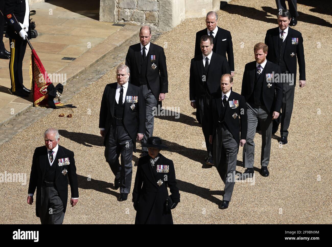 The Prince of Wales, the Duke of York, the Duke of Cambridge, Peter Phillips, the Princess Royal, the Earl of Wessex, the Duke of Sussex, the Earl of Snowdon and Vice-Admiral Sir Timothy Laurence follow the Duke of Edinburgh's coffin, covered with his Personal Standard, on the purpose built Land Rover Defender during the Ceremonial Procession ahead of the funeral of the Duke of Edinburgh in Windsor Castle, Berkshire. Picture date: Saturday April 17, 2021. Stock Photo