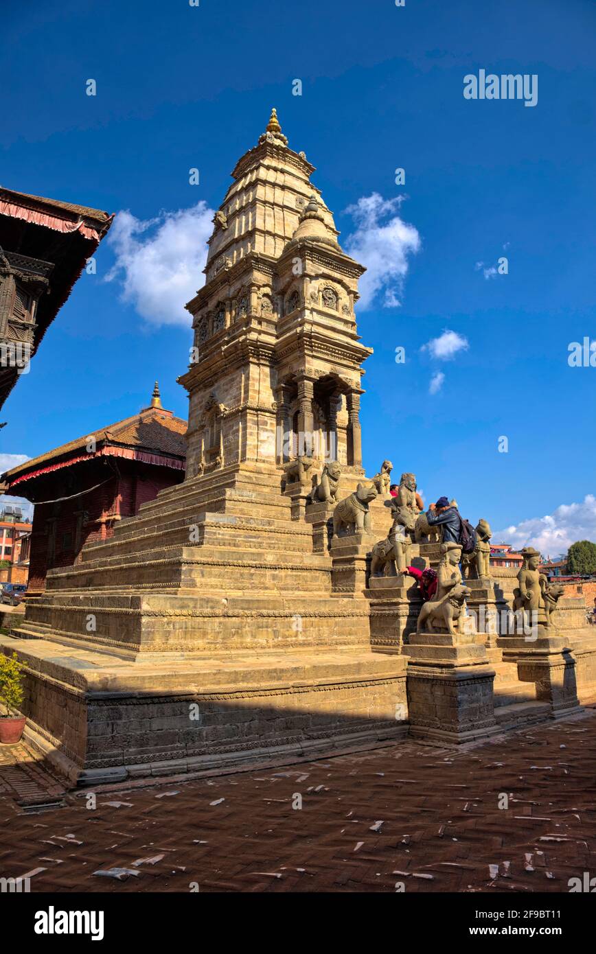 The Siddhi Lakshmi Temple is located just beside the 55 Windows palace in Bhaktapur Durbar Square. The temple has a staircase guarded by a male and fe Stock Photo