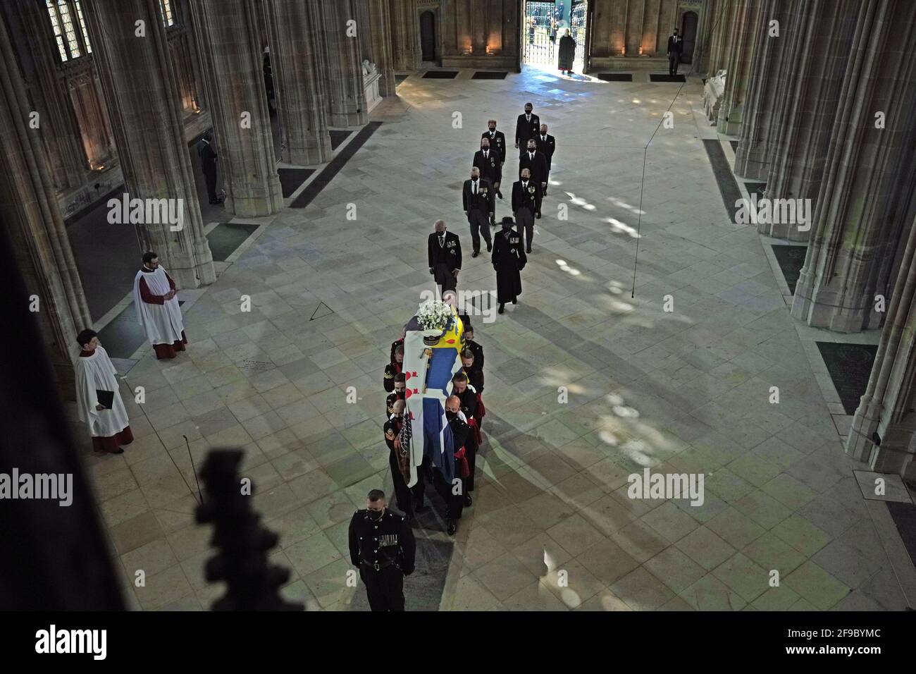 Pall Bearers carrying the coffin of the Duke of Edinburgh, followed by (left to right, first row) the Prince of Wales, Princess Anne, ((left to right, second row) the Duke of York, the Earl of Wessex, ((left to right, third row) the Duke of Cambridge, Peter Phillips, (left to right, fourth row) the Duke of Sussex, the Earl of Snowdon and (back) Vice Admiral Sir Timothy Laurence, entering St George's Chapel, Windsor Castle, Berkshire. Picture date: Saturday April 17, 2021. Stock Photo