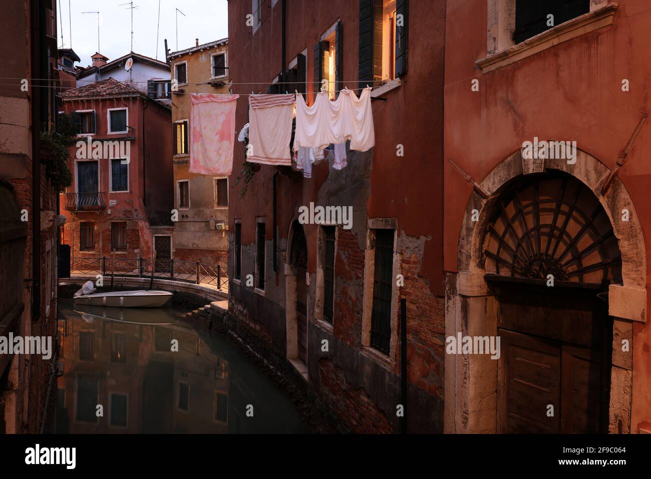 Venice, small canal with clothesline and laundry in the historic district of San Marco, Italy Stock Photo