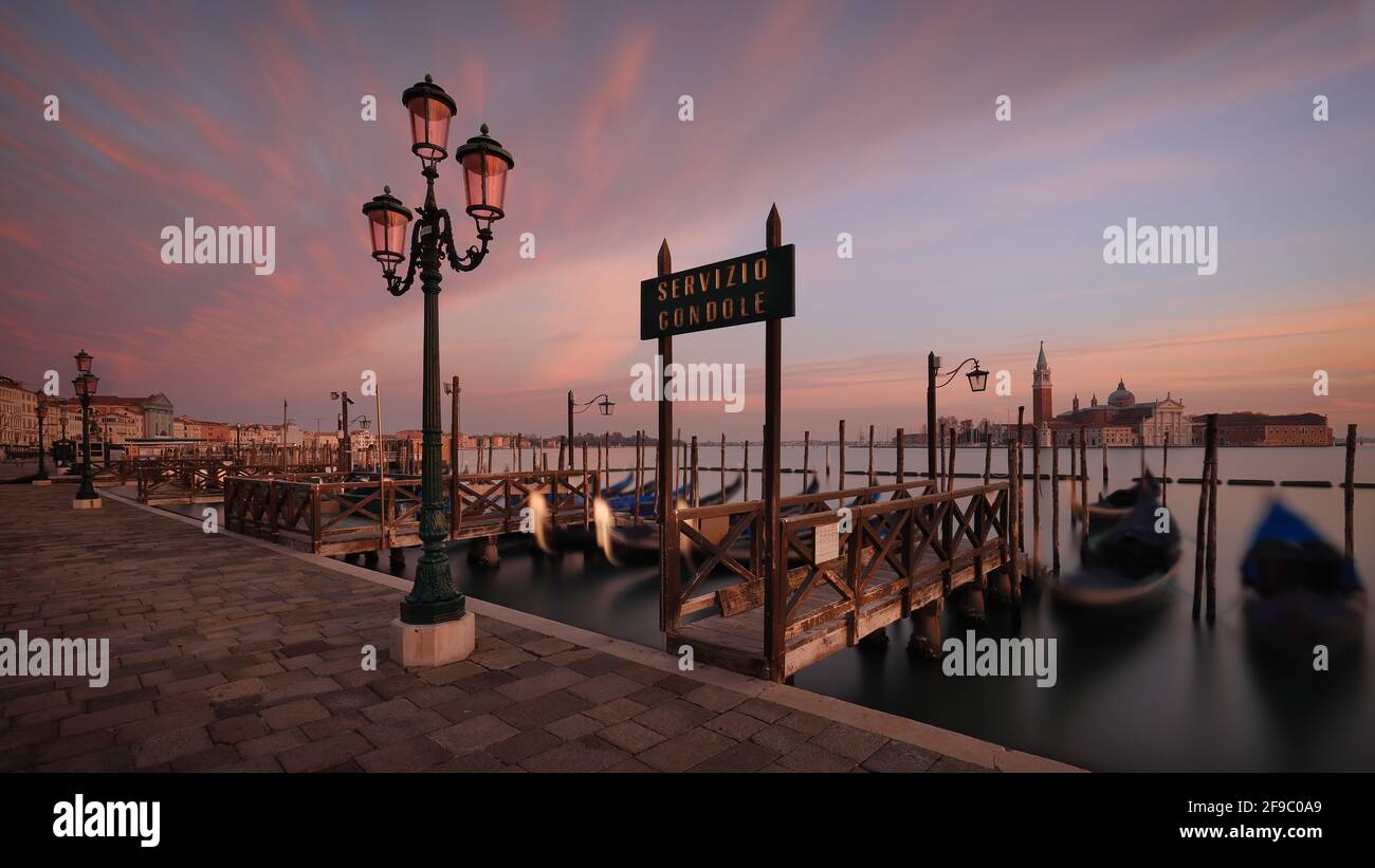 Piazza San Marco and waterfront promenade at sunset in Venice, Italy Stock Photo