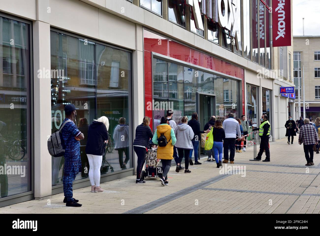 End of covid-19 lockdown with customers queuing outside TK Max shop in shopping centre Stock Photo