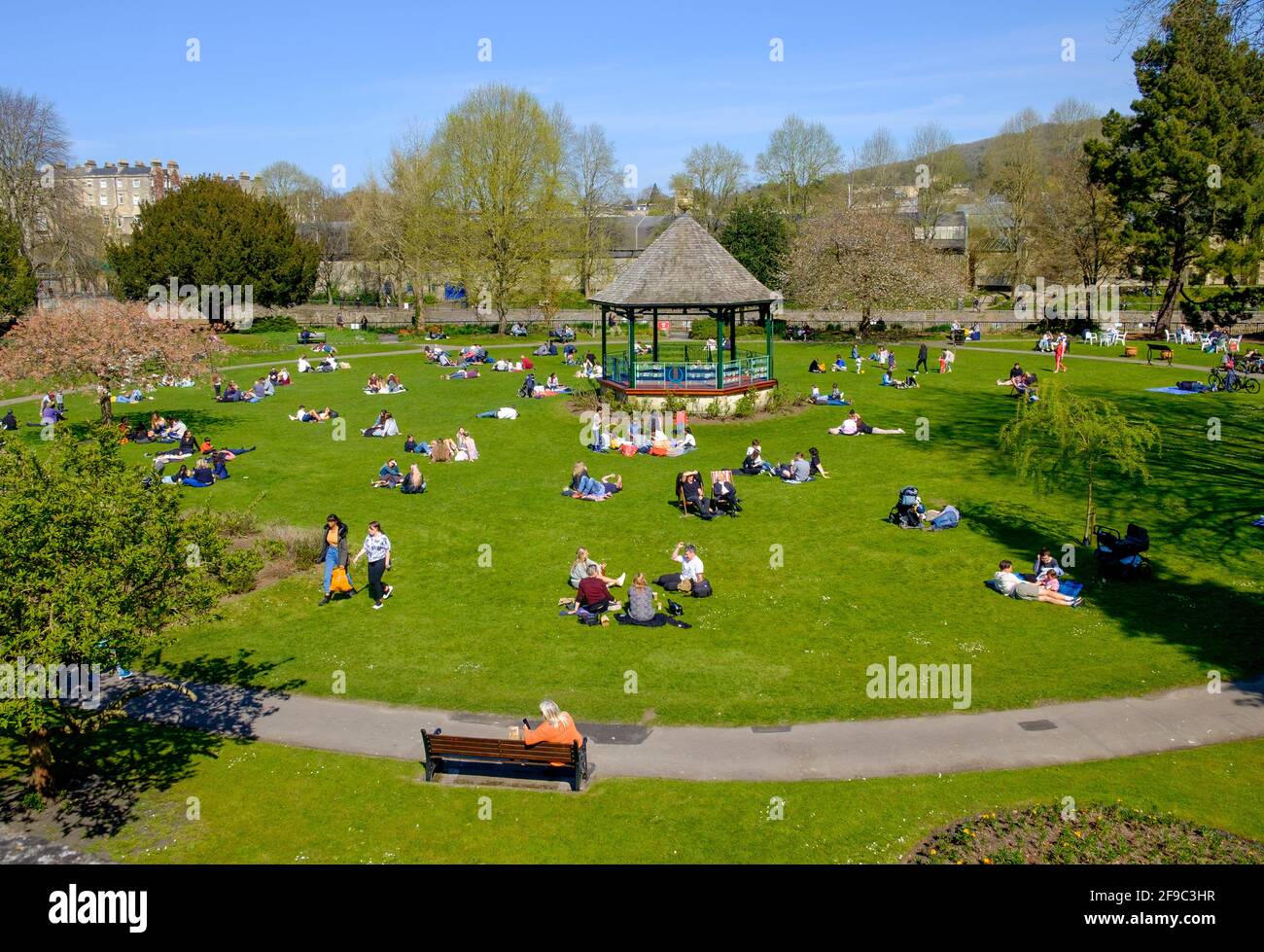 Bath, Somerset, UK. 17th April, 2021. On the first Saturday after the Covid stay at home lockdown restrictions were lifted in England, people are pictured enjoying the sunshine in Parade Gardens. Credit: Lynchpics/Alamy Live News Stock Photo