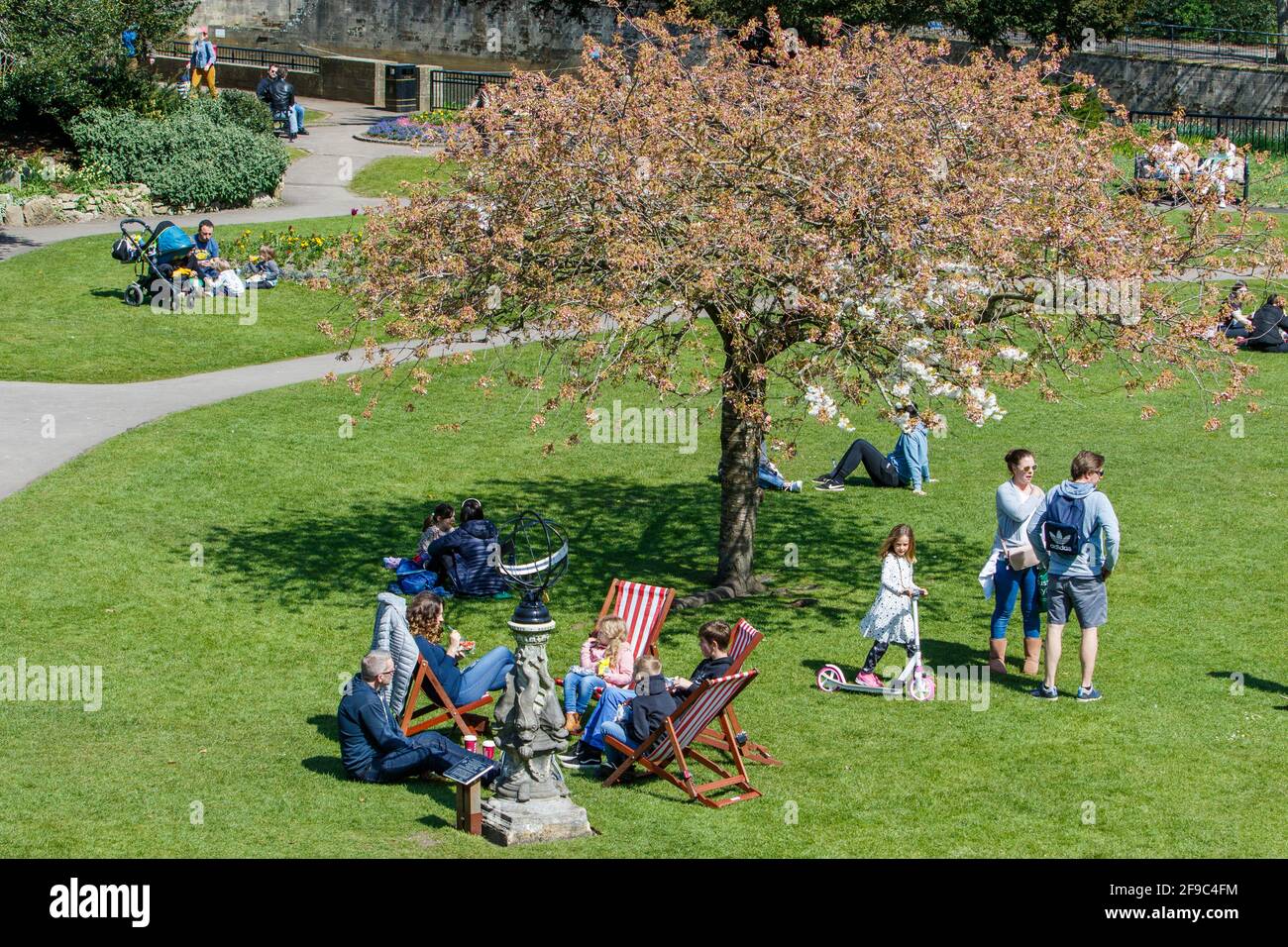 Bath, Somerset, UK. 17th April, 2021. On the first Saturday after the Covid stay at home lockdown restrictions were lifted in England, people are pictured enjoying the sunshine in Parade Gardens. Credit: Lynchpics/Alamy Live News Stock Photo