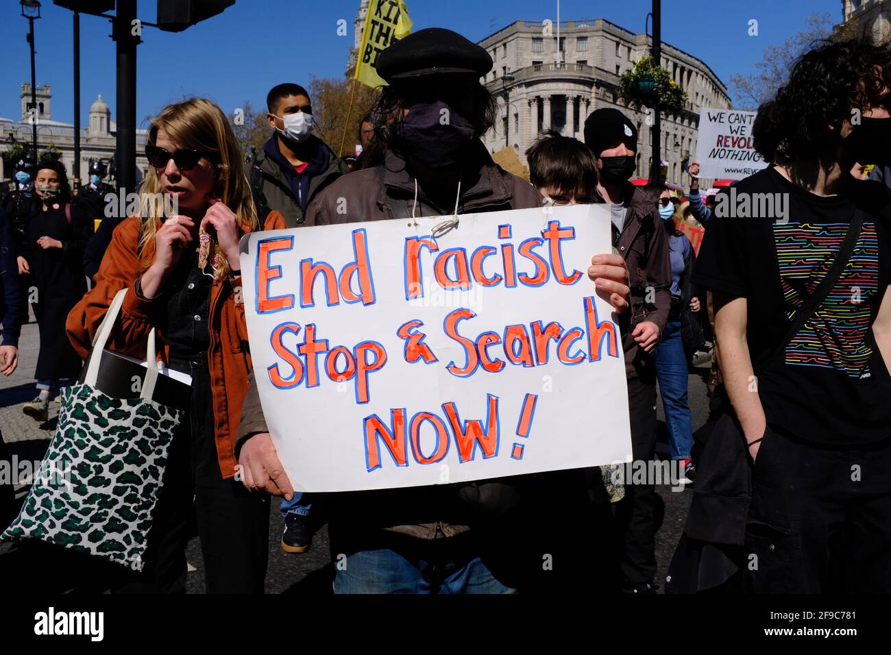 London, England. 17th Apr 2021. Kill the Bill protest against the newly proposed Police, Crime, Sentencing and Courts Bill that the government are trying to pass.  A protester holds up a sign that says 'End Racist Stop and Search'. Bradley Stearn / Alamy Live News Stock Photo