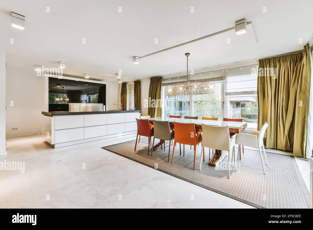 Picture of Dining area with open kitchen in luxury apartment Stock Photo - Alamy