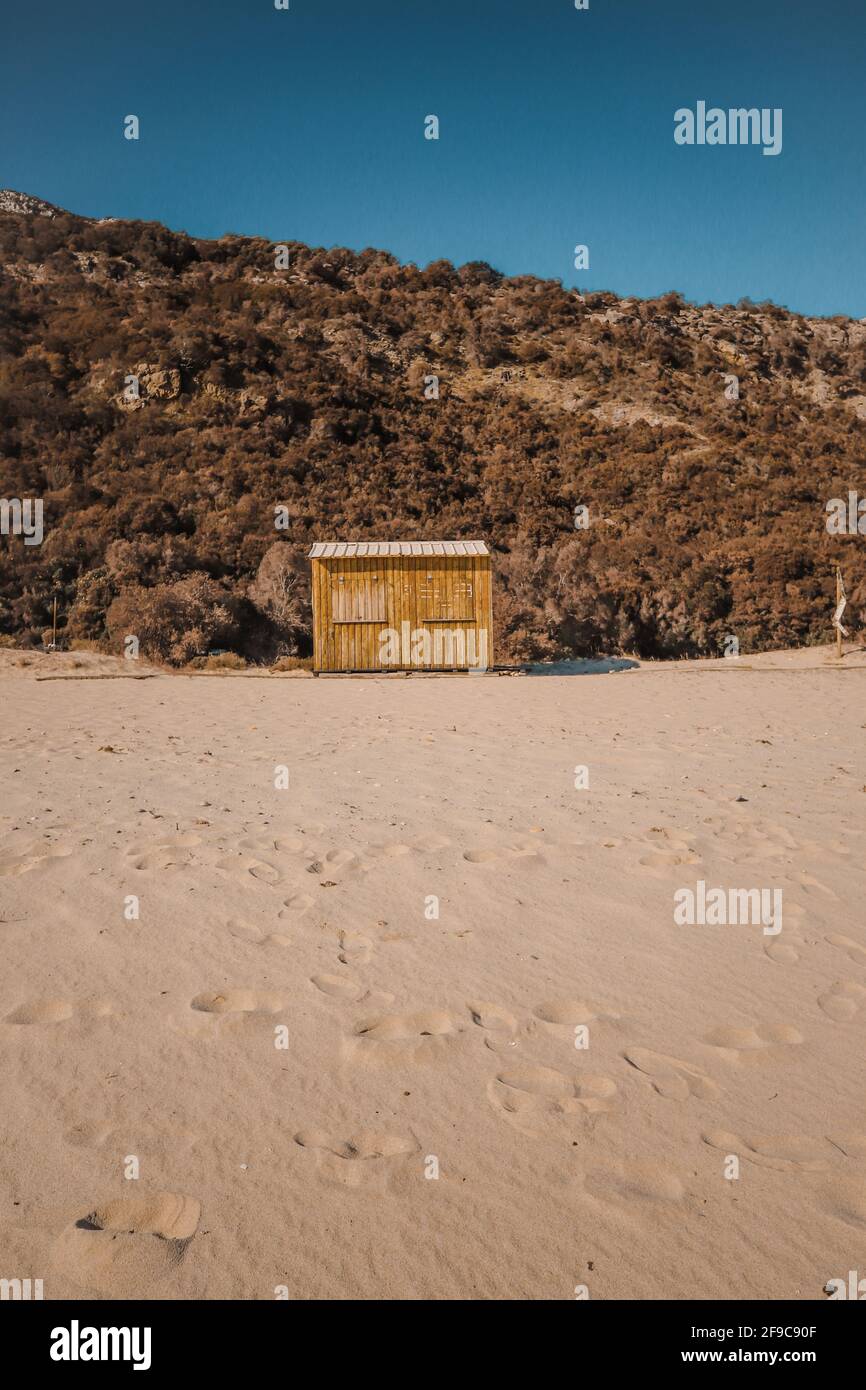 Wooden yellow hut on the beach Stock Photo