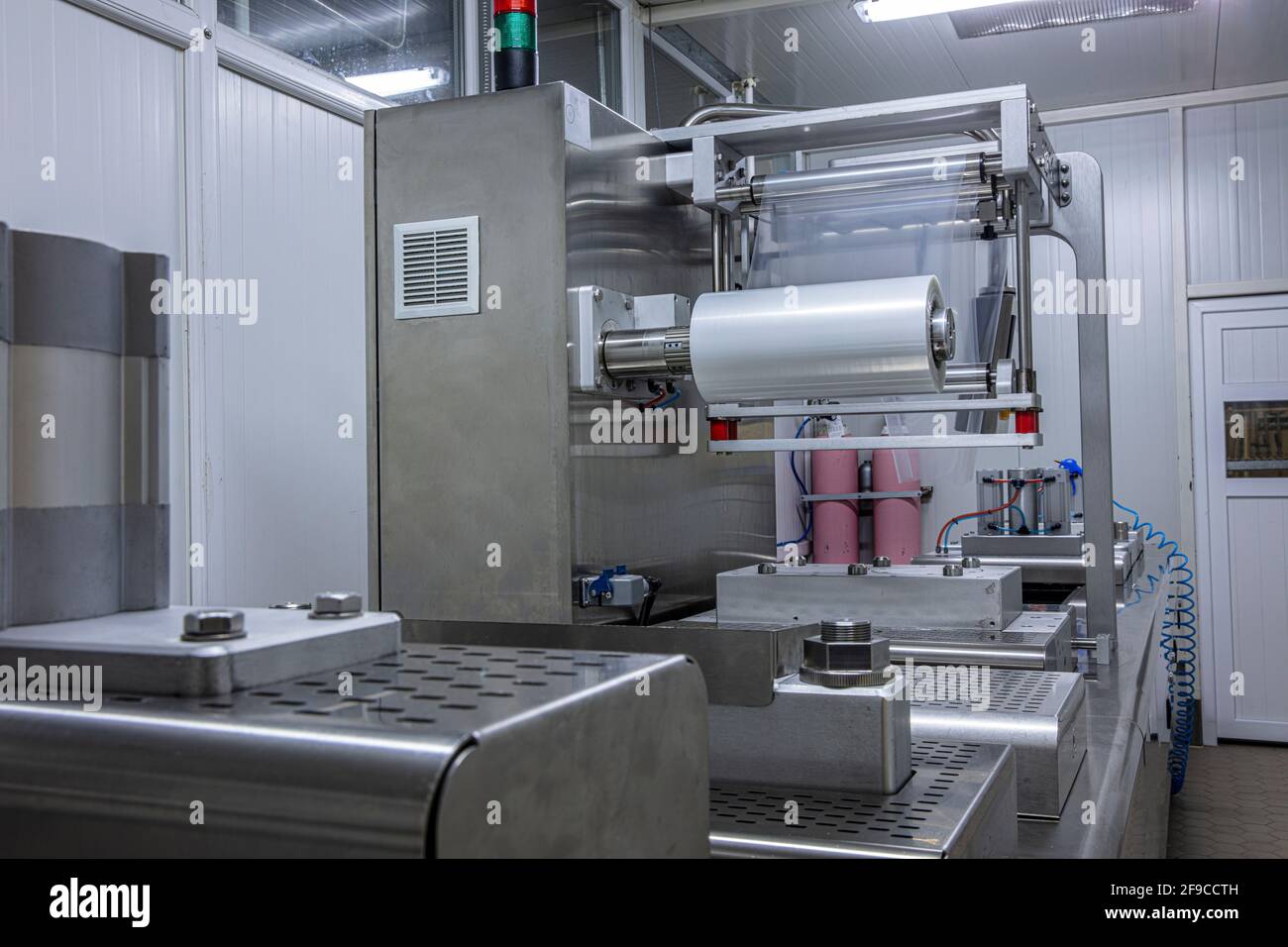 Processing of Packaging of butter and Cheese on food vacuum packaging sealing machine in food
