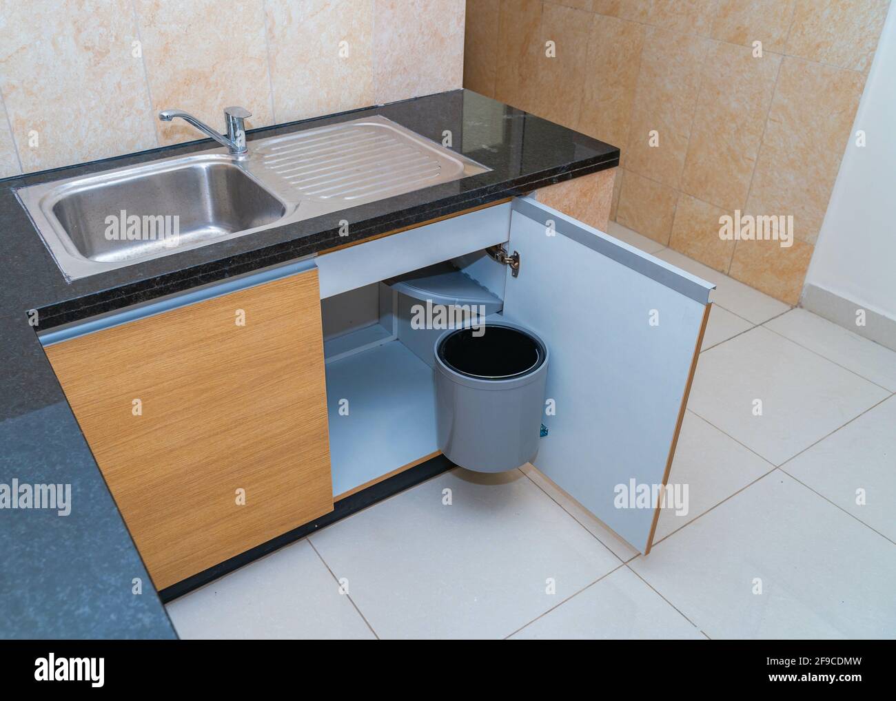 Waste bin inside a sink Stock Photo Alamy