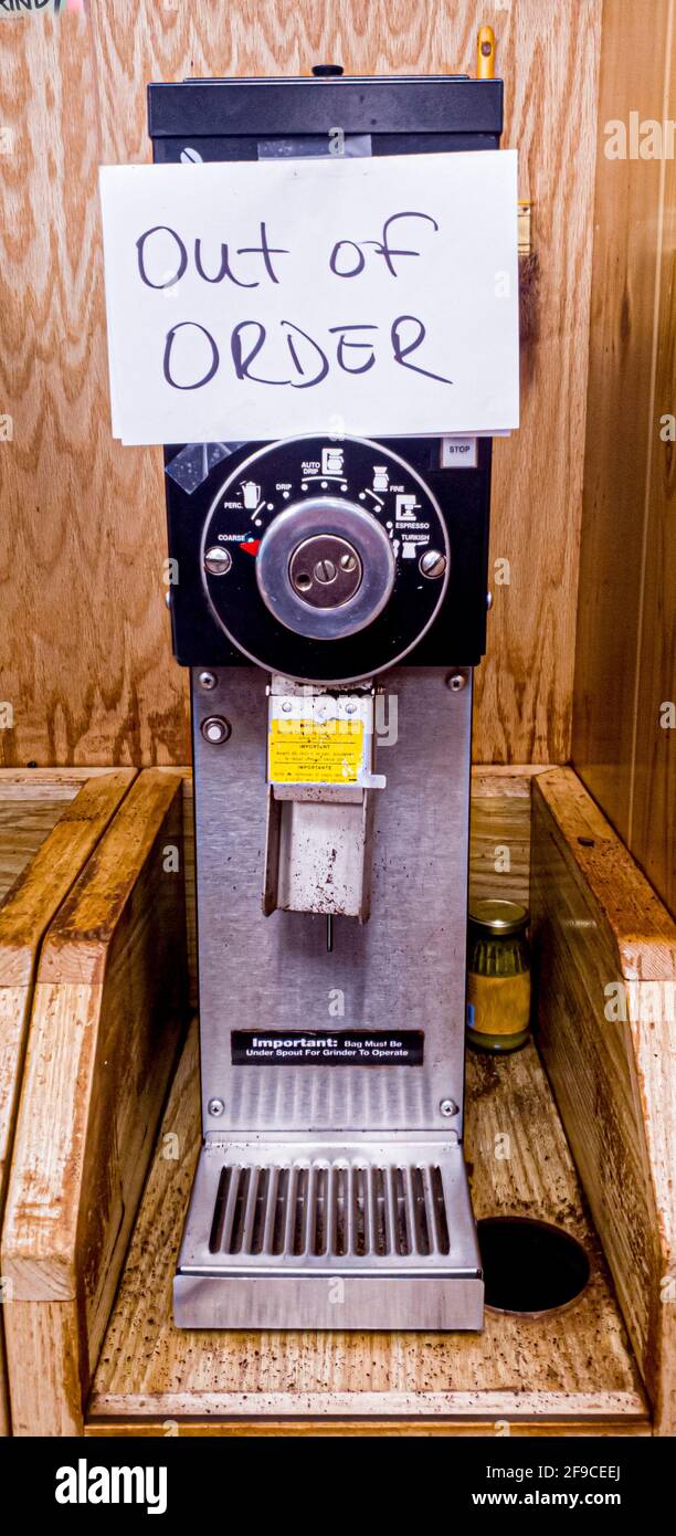 A vertical heavy duty electrical coffee grinder for customer use