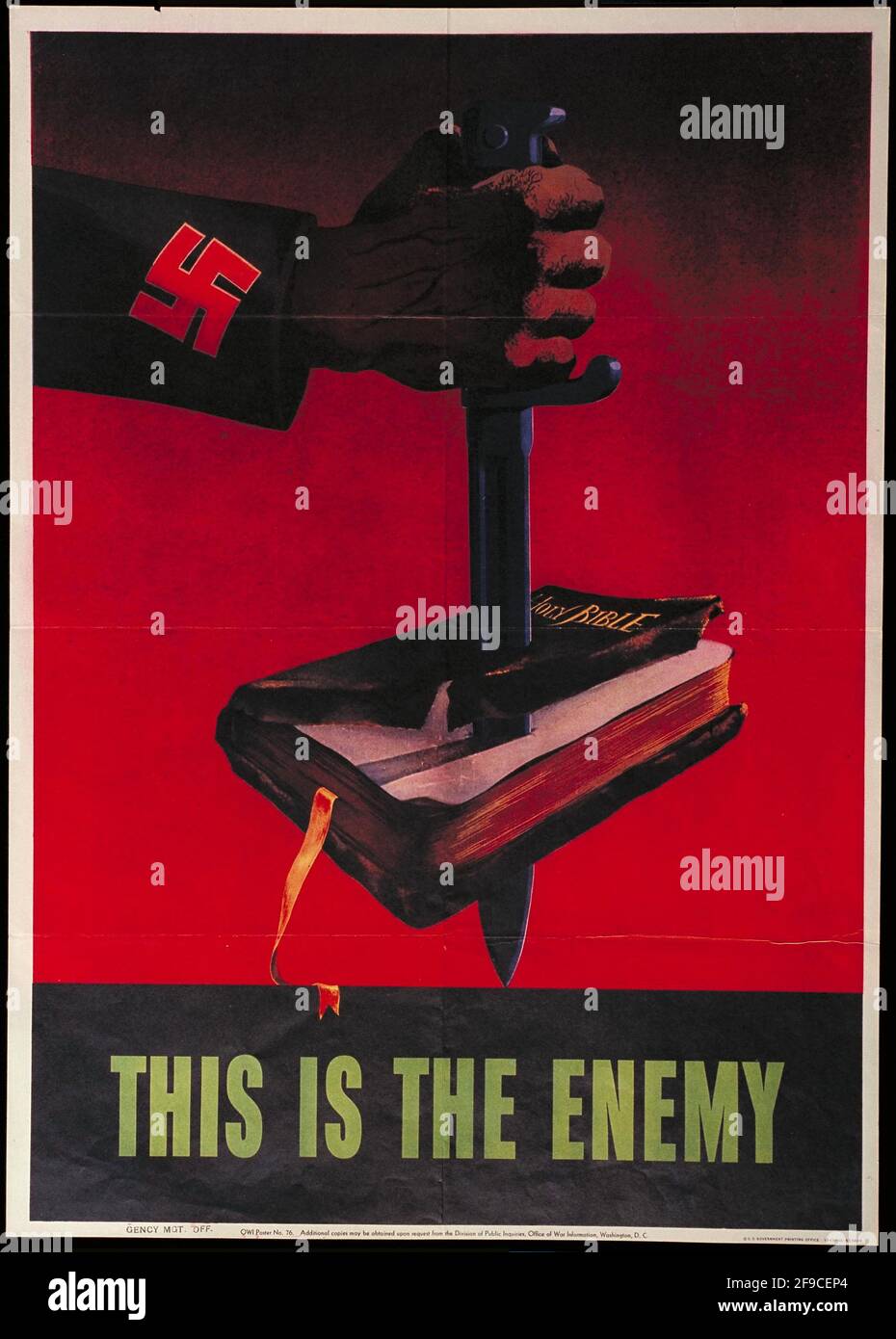 An American WW2 propaganda poster showing a swastika on a sleeve with the hand stabbing the bible Stock Photo