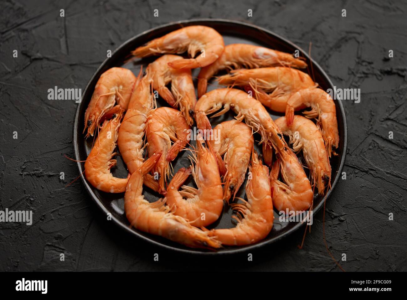 Boiled Big Sea Prawns Or Shrimps Placed On Black Ceramic Plate Stock Photo Alamy