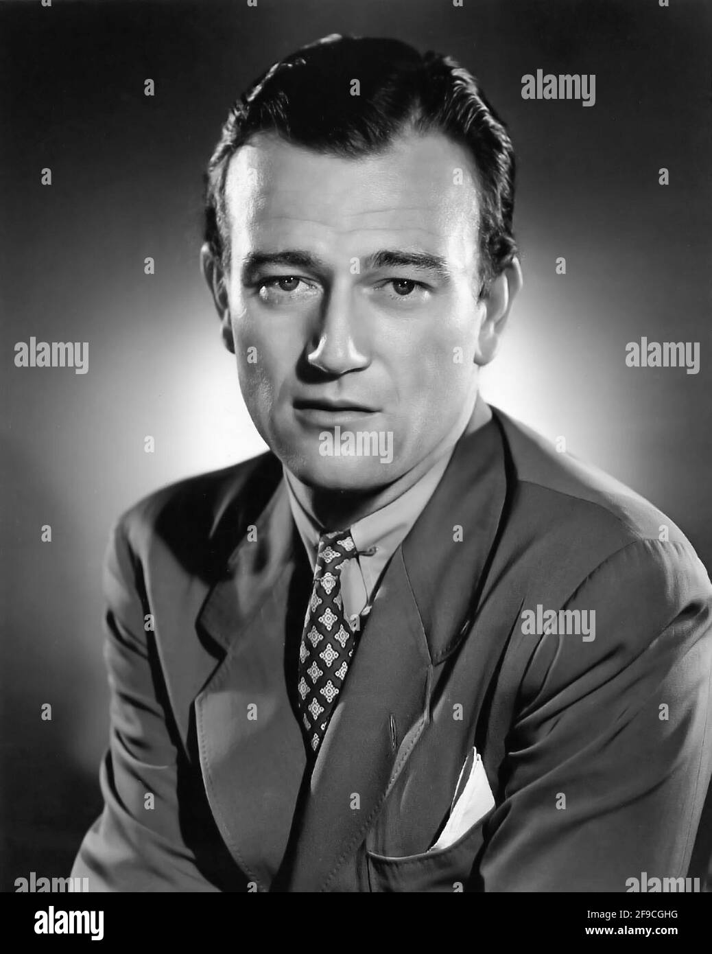 John Wayne. Portrait of the American actor, John Wayne (b. Marion Robert Morrison, 1907-1979), publicity still from 'The Long Voyage Home', 1940 Stock Photo